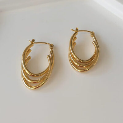 Brinco aço dourado oval triplo